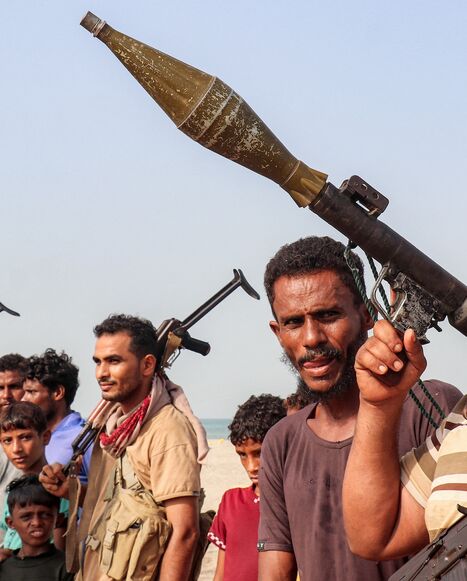 Fighters supporting the Aden-based, internationally recognized Yemeni government gather during a vigil along the Red Sea shore in Khokha, in Yemen's western Hodeidah province, on July 20, 2026. 