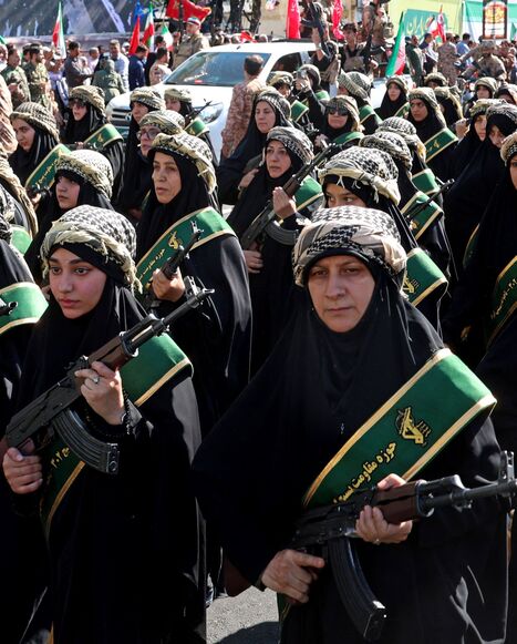 Members of Iran's Basij paramilitary force march 