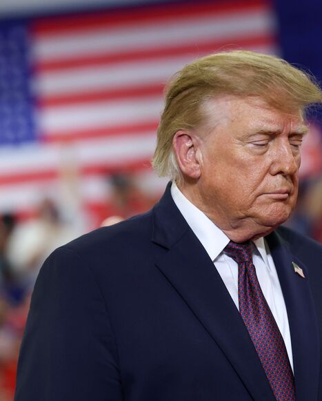 US President Donald Trump walks on stage