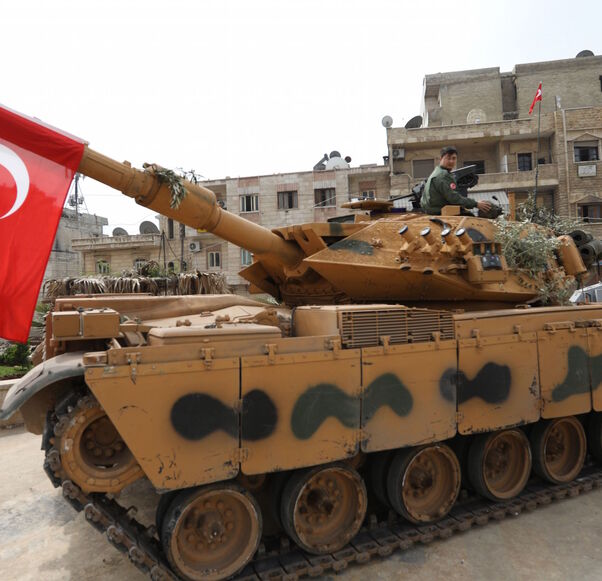 A tank belonging to Turkish soldiers and Ankara-backed Syrian Arab fighters is seen in the Kurdish-majority city of Afrin in northwestern Syria after they took control of it from Kurdish People's Protection Units (YPG) on March 18, 2018.
Turkish-backed rebels have seized the centre of Afrin city in northern Syria, Ankara said, as they made rapid gains in their campaign against Kurdish forces. A civilian inside Afrin said that rebels had deployed in the city centre and that the Kurdish People's Protection Un