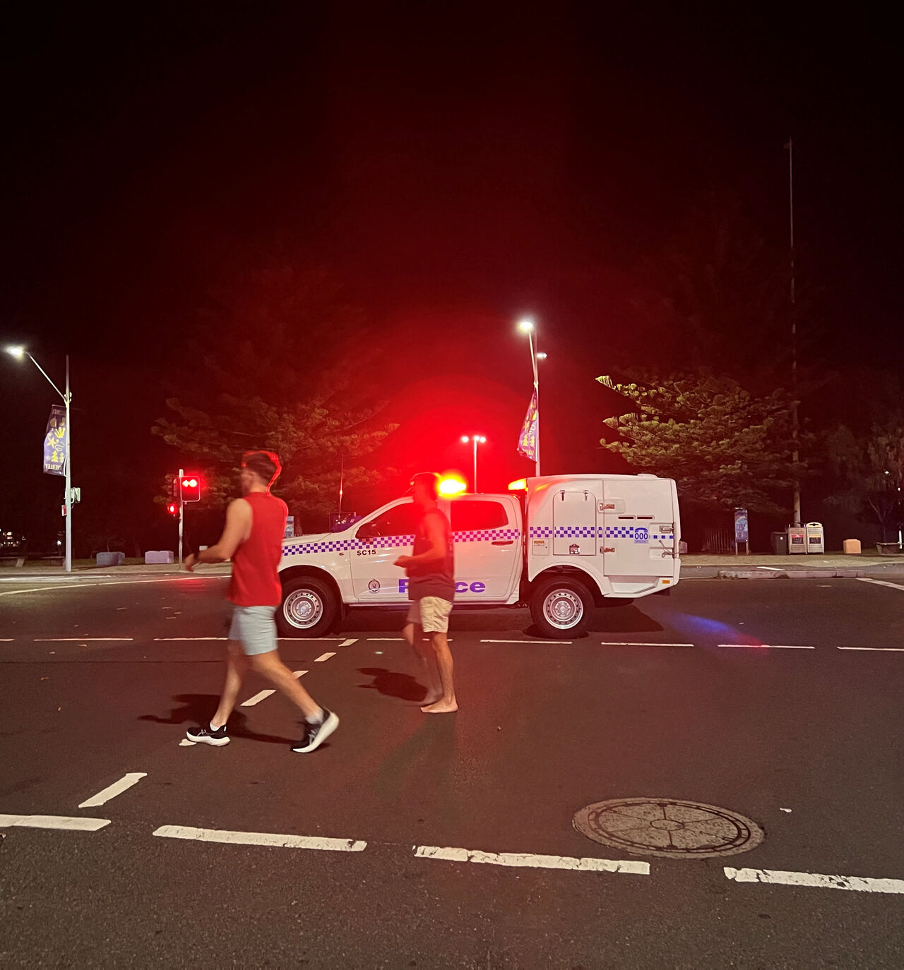 People walk at the scene of a shooting incident at Bondi Beach, Sydney, Australia, December 14, 2025. REUTERS/Kirsty Needham