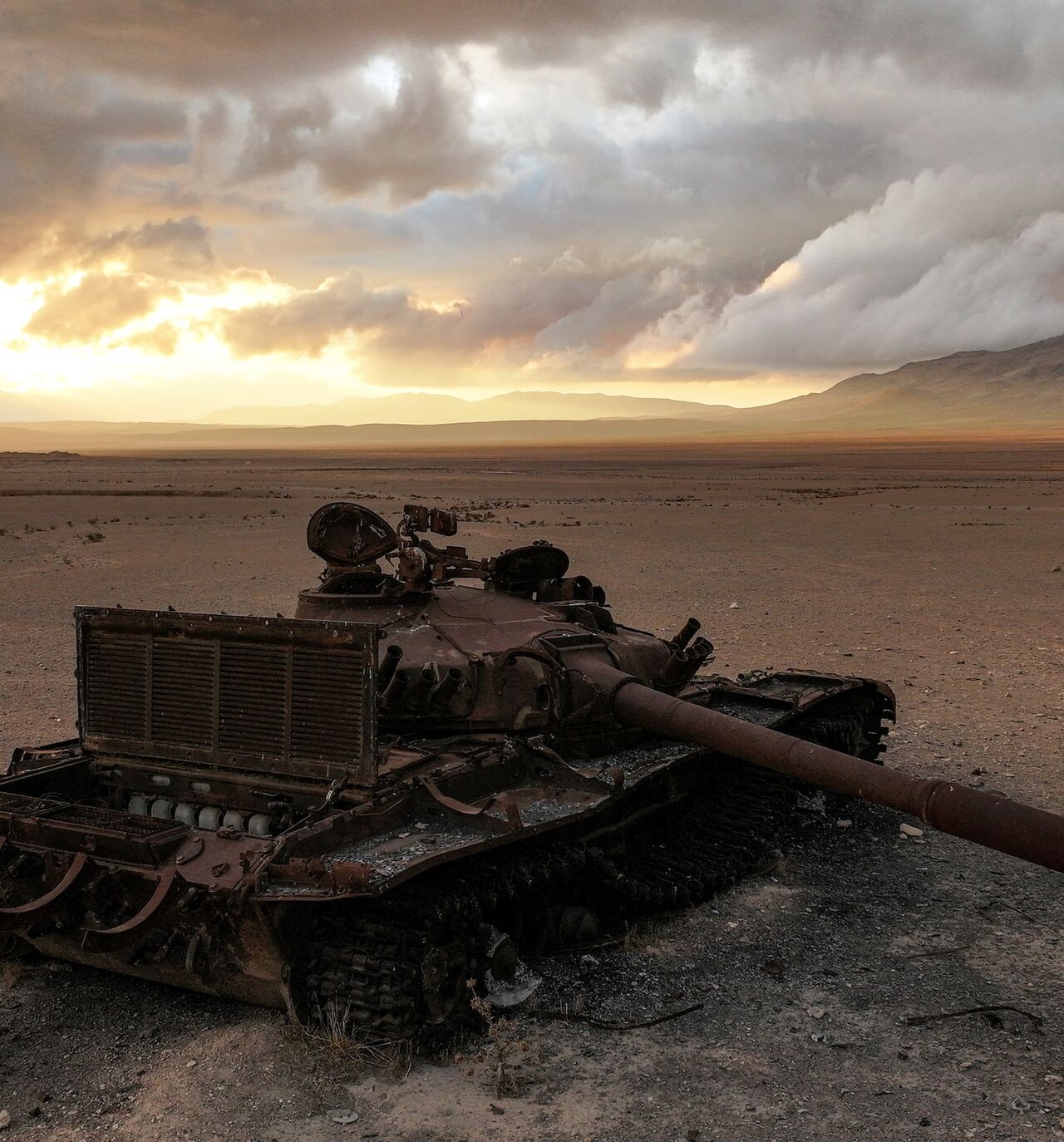 A destroyed Syrian army battle tank lies abandoned near the ancient ruins of Palmyra in central Syria on Feb. 7, 2025. 