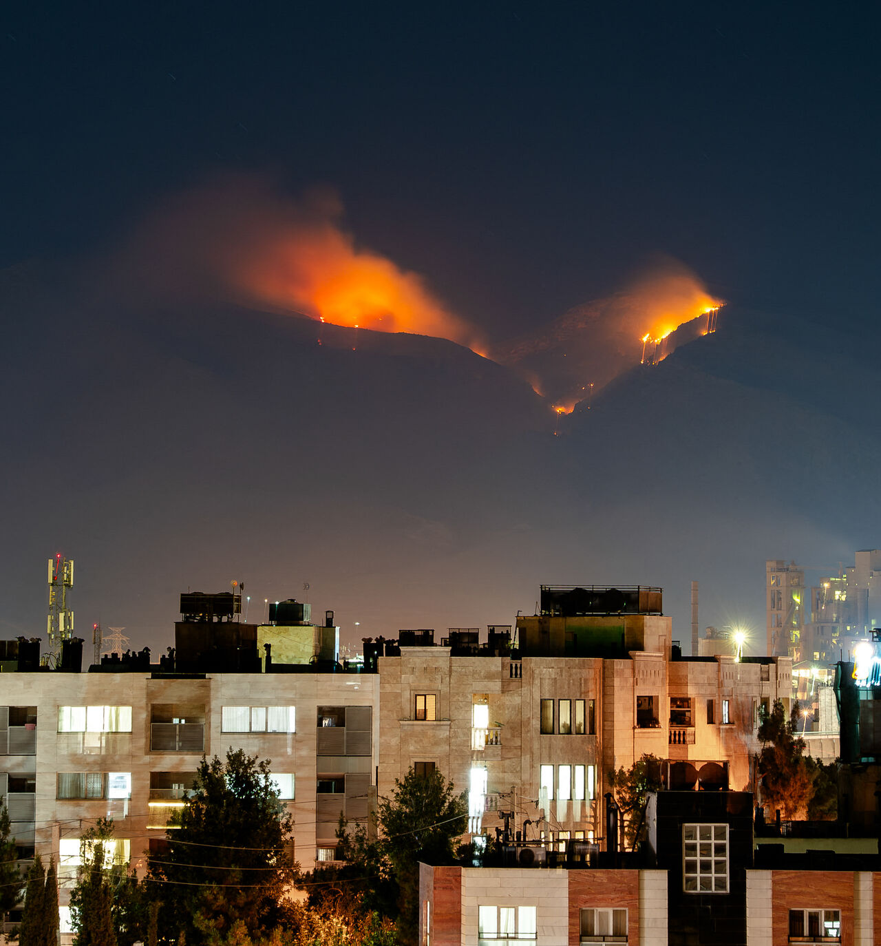 Smoke rises as fire burns, in an alleged site of IRGC's missile launch targeted by Israel on the mountains of Shiraz, Iran on June 21, 2025. Israel attacked Iran in early hours of June 13, and the exchange of fire between the two countries continues ever since. (Photo by Hiroon / Middle East Images via AFP) (Photo by HIROON/Middle East Images/AFP via Getty Images)