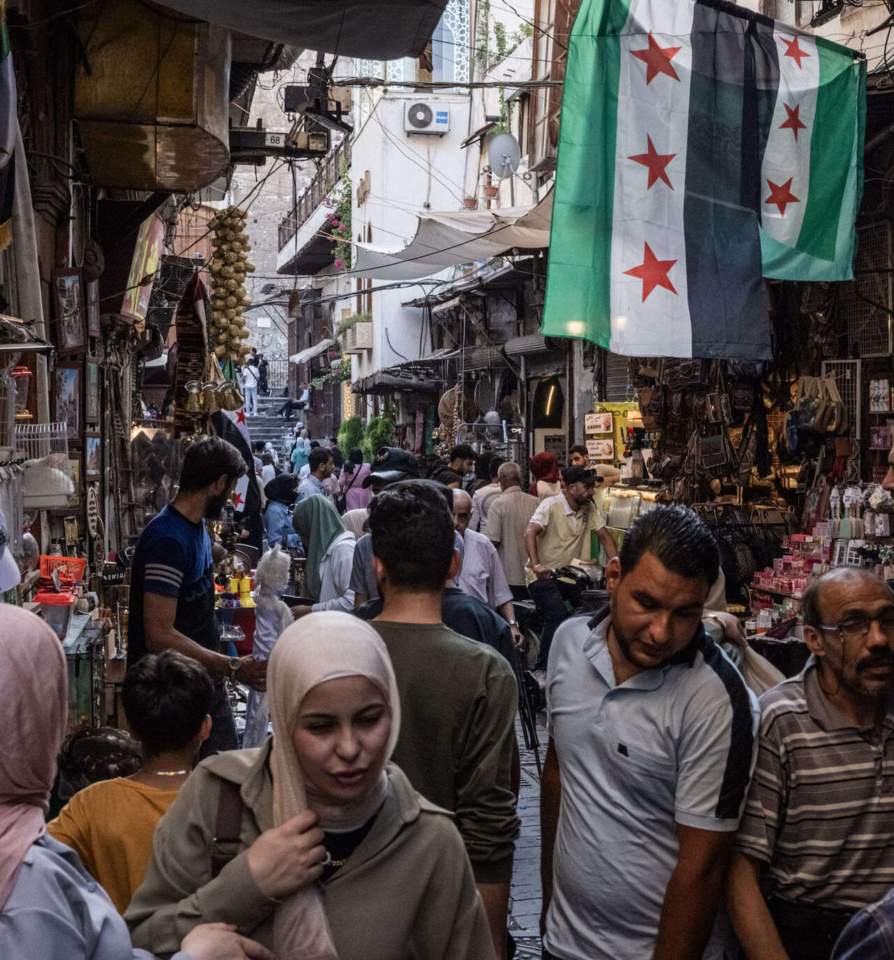 People shop in a market on June 17, 2025 in Damascus, Syria. 