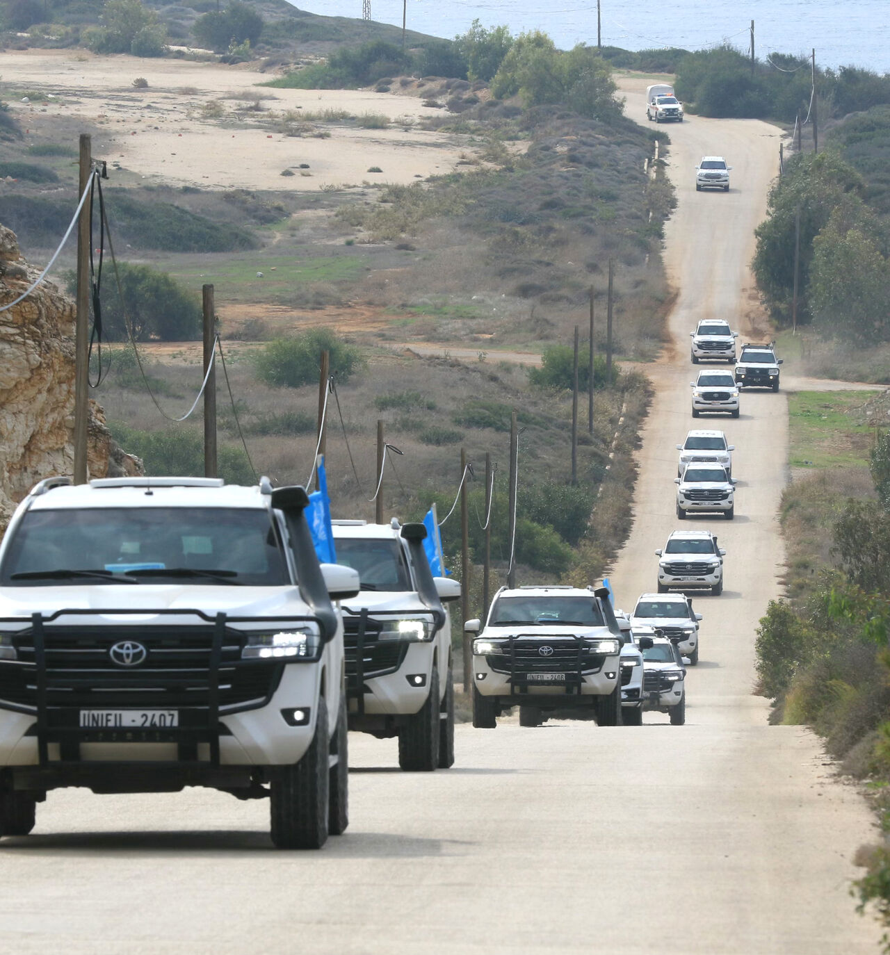 A convoy carrying a UN security council delegation, tours the border with Israel close to the southern Lebanese area of Naqura on December 6, 2025. UNIFIL peacekeepers have been tasked with acting as a buffer between Israel and Lebanon since March 1978, and with monitoring the November 2024 ceasefire that sought to halt more than a year of hostilities between Israel and Hezbollah. (Photo by Mahmoud ZAYYAT / AFP via Getty Images)