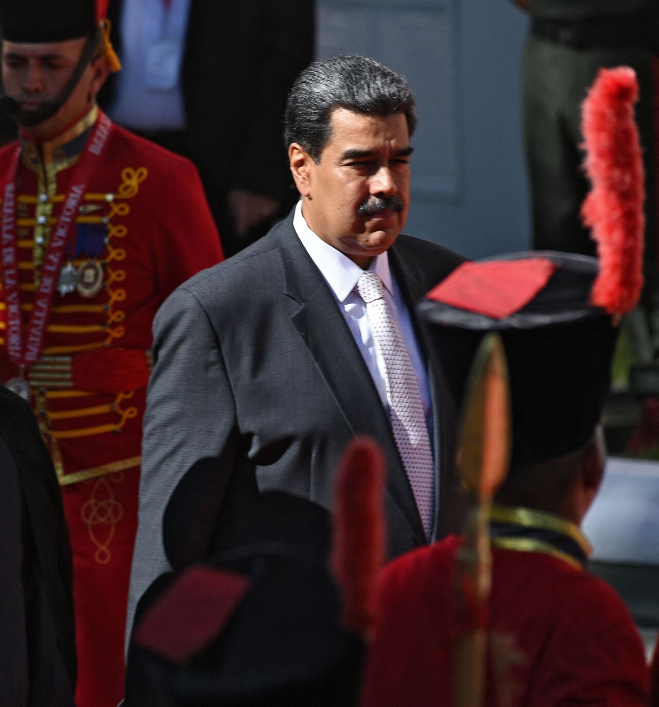 Iranian President Ebrahim Raisi (L) is welcomed by Venezuelan President Nicolas Maduro at Miraflores Presidential Palace in Caracas, on June 12, 2023. Iranian President Ebrahim Raisi arrived in Venezuela Monday for the start of a visit to "friendly countries" that also include Cuba and Nicaragua, all under sanctions from a common adversary, the United States. (Photo by Yuri CORTEZ / AFP) (Photo by YURI CORTEZ/AFP via Getty Images)