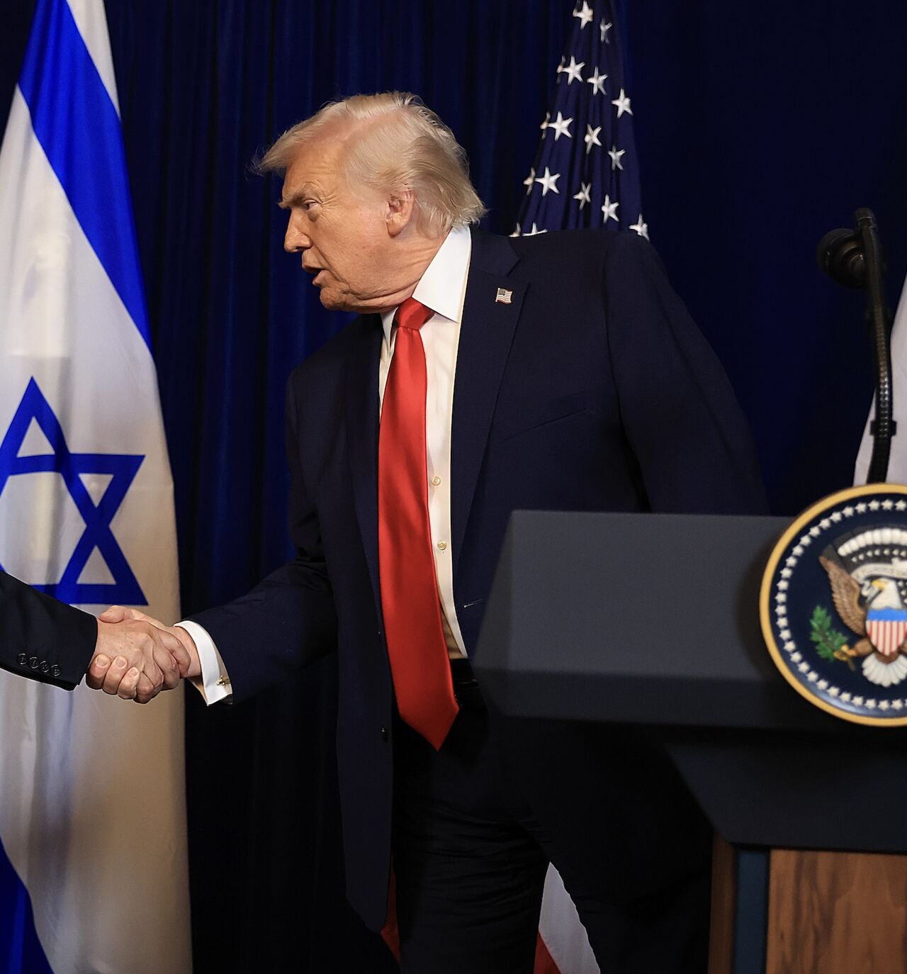 US President Donald Trump shakes hands with Israeli Prime Minister Benjamin Netanyahu during a press conference at his Mar-a-Lago club on Dec. 29, 2025, in Palm Beach, Florida.