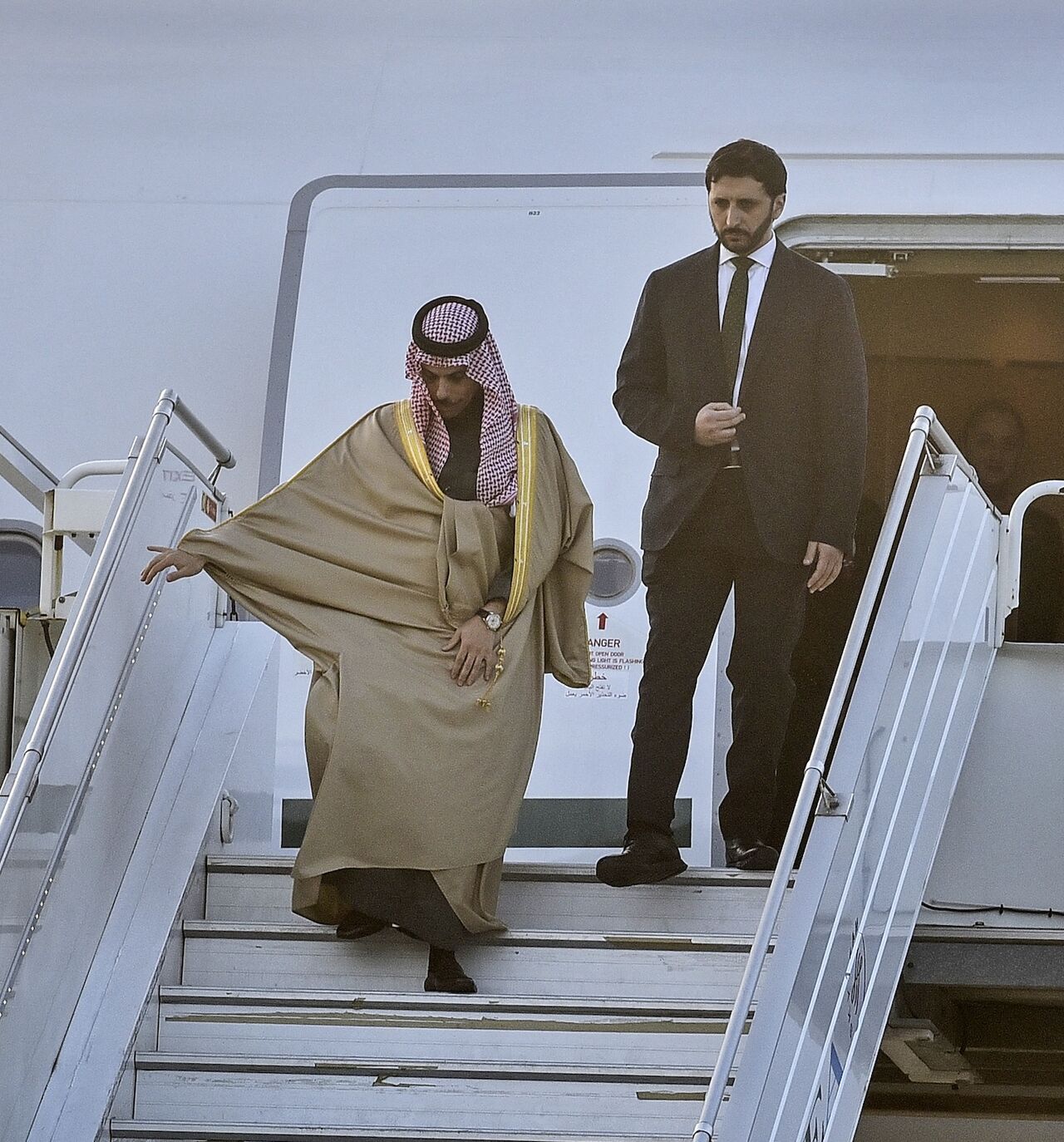 Saudi Arabia's Foreign Minister Faisal bin Farhan (L) disembarks from an airplane upon his arrival at the Rafic Hariri International Airport in Beirut on Jan. 23, 2025. 