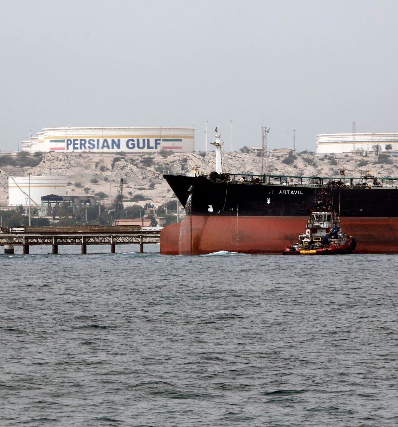 A picture taken on March 12, 2017, shows an Iranian tanker docking at the platform of the oil facility in the Kharg Island, on the shore of the Gulf.