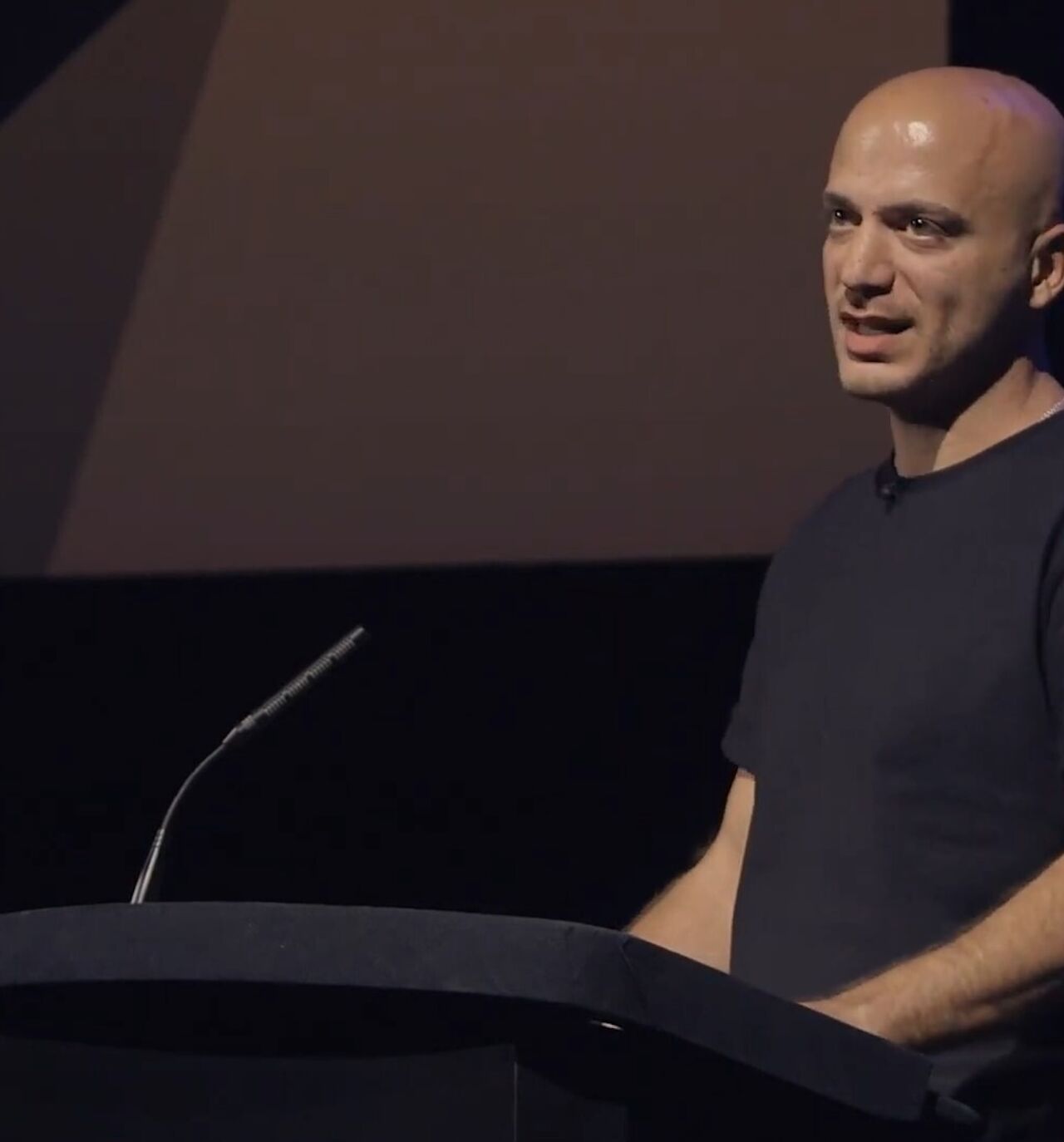  Hassan Akkad speaks about fleeing Syria in 2015 and his work as a filmmaker at a BAFTA event, Sept. 2023.