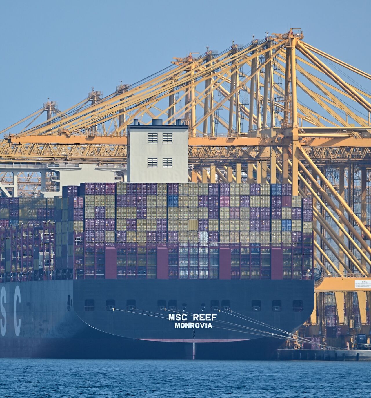 The Liberian-flagged container vessel MSC Reef is seen docked along a pier at the Khor Fakkan Container Terminal, the only natural deep-sea port in the region and one of the major container ports in Sharjah Emirate, along the Gulf of Oman, on June 28, 2026.