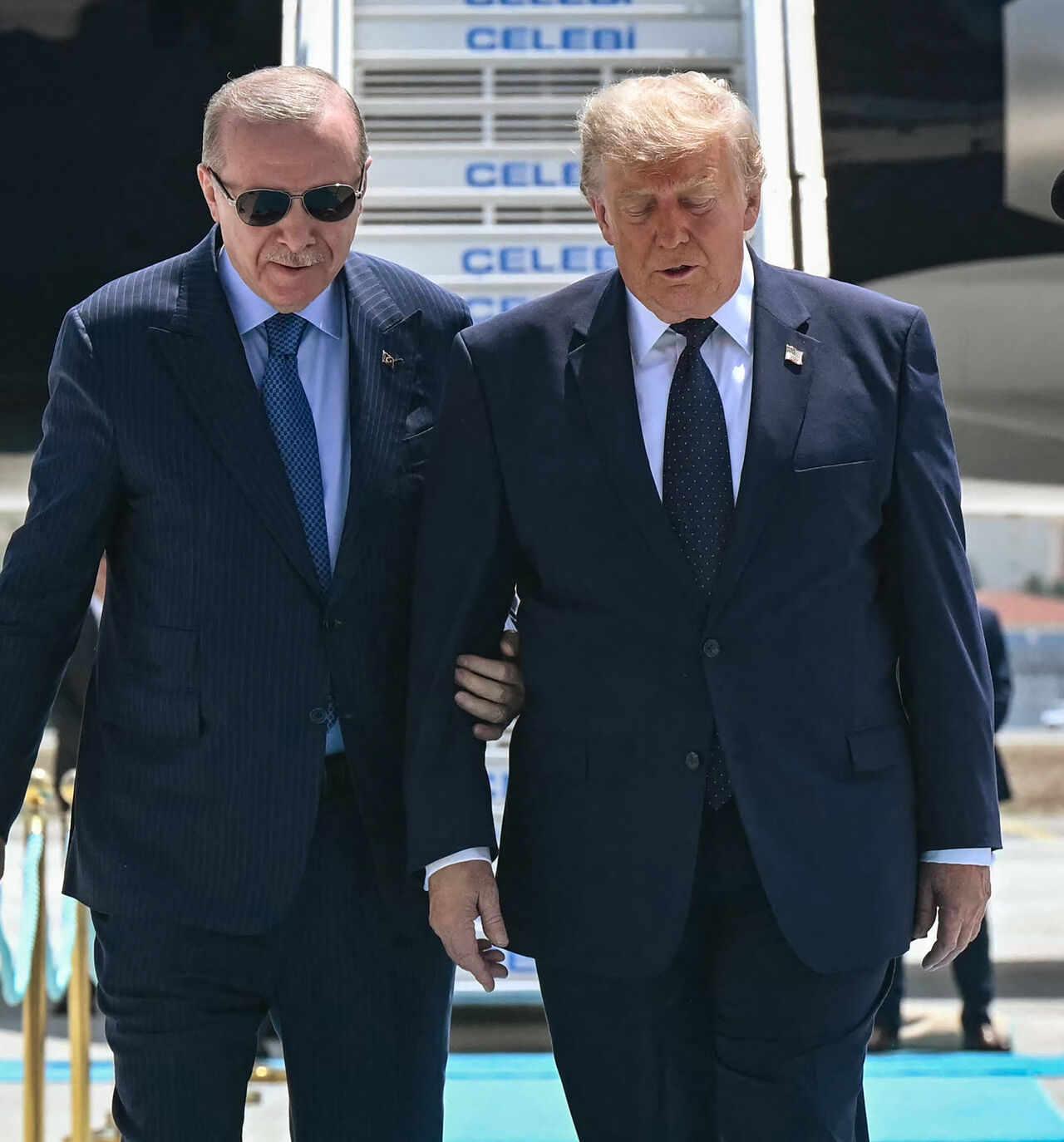 Turkish President Recep Tayyip Erdogan (L) welcomes US President Donald Trump (R) upon his arrival on Air Force One at Etimesgut Air Base near Ankara, on July 7, 2026, before attending the 36th NATO Heads of State and Government Summit. (Photo by SAUL LOEB / AFP via Getty Images)