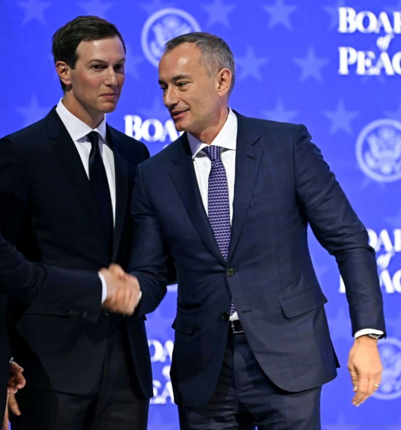 US Special Envoy Steve Witkoff (L) shakes hands with Nickolay Mladenov, Bulgarian High Representative for Gaza (R) next to US businessman Jared Kushner at the "Board of Peace" meeting during the World Economic Forum (WEF) annual meeting in Davos on January 22, 2026