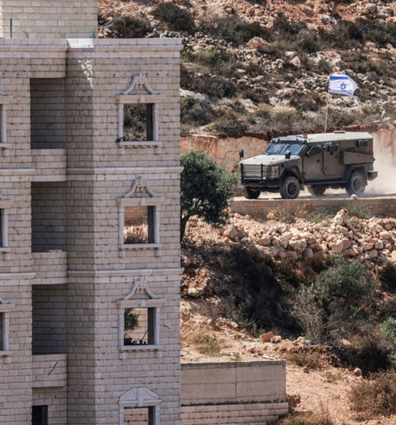 Israeli soldiers arrive in the village of Qusra after a group of settlers occupied a building while Palestinians were inside