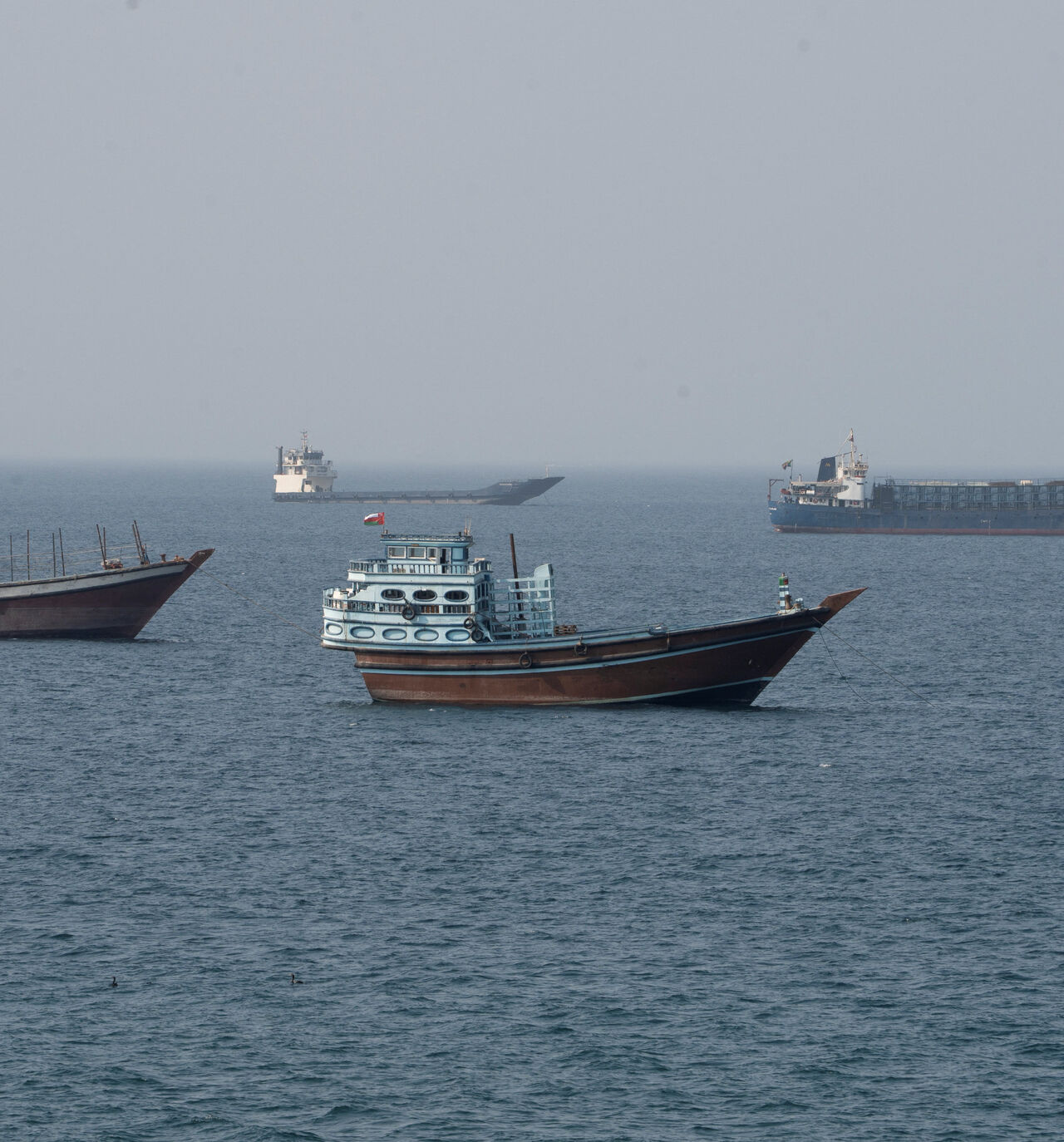 Vessels near the Strait of Hormuz, as seen from Musandam, Oman, August 17, 2026. REUTERS/Stringer