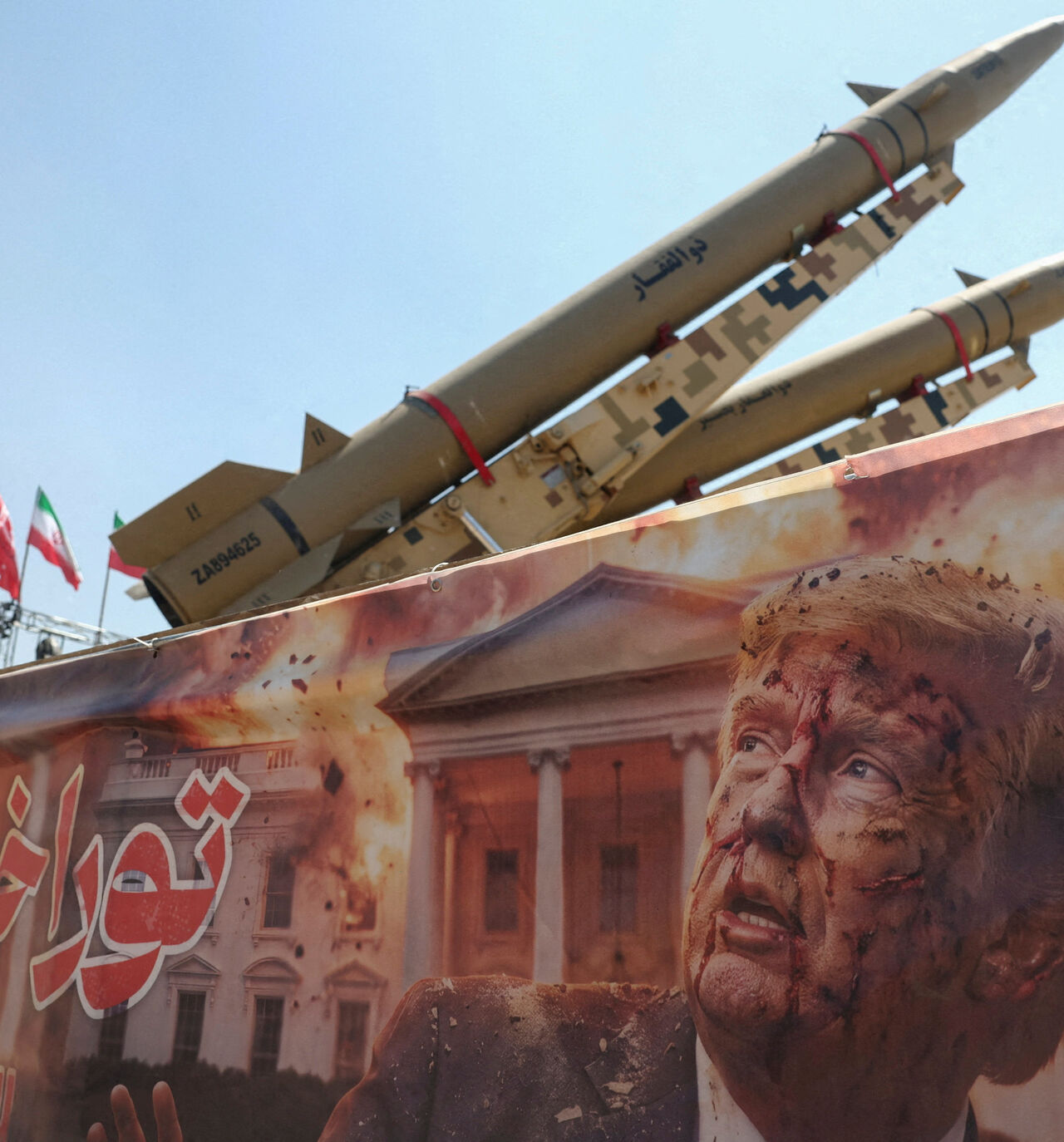 A banner with a picture of U.S. President Donald Trump next to an Iranian missile system at Azadi Square in Tehran, Iran, July 30, 2026. Majid Asgaripour/WANA (West Asia News Agency) via REUTERS