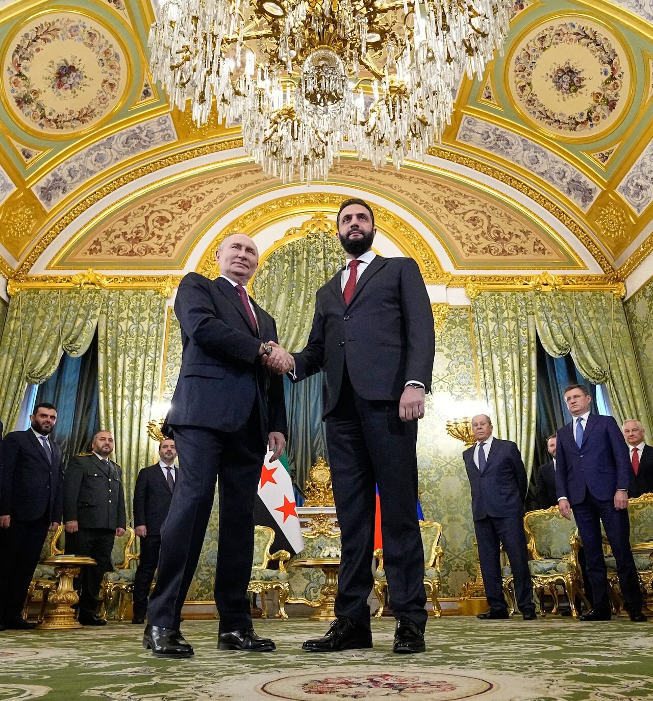 Russian President Vladimir Putin greets Syrian President Ahmed al-Sharaa at the Grand Kremlin Palace, Moscow, Oct. 15, 2025.