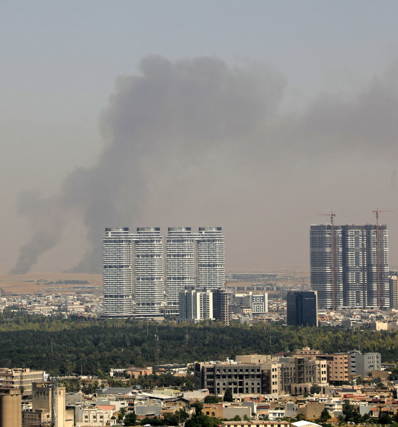 Smoke rises after explosions were heard and air defences activated near the airport in Erbil, on July 24, 2026.  