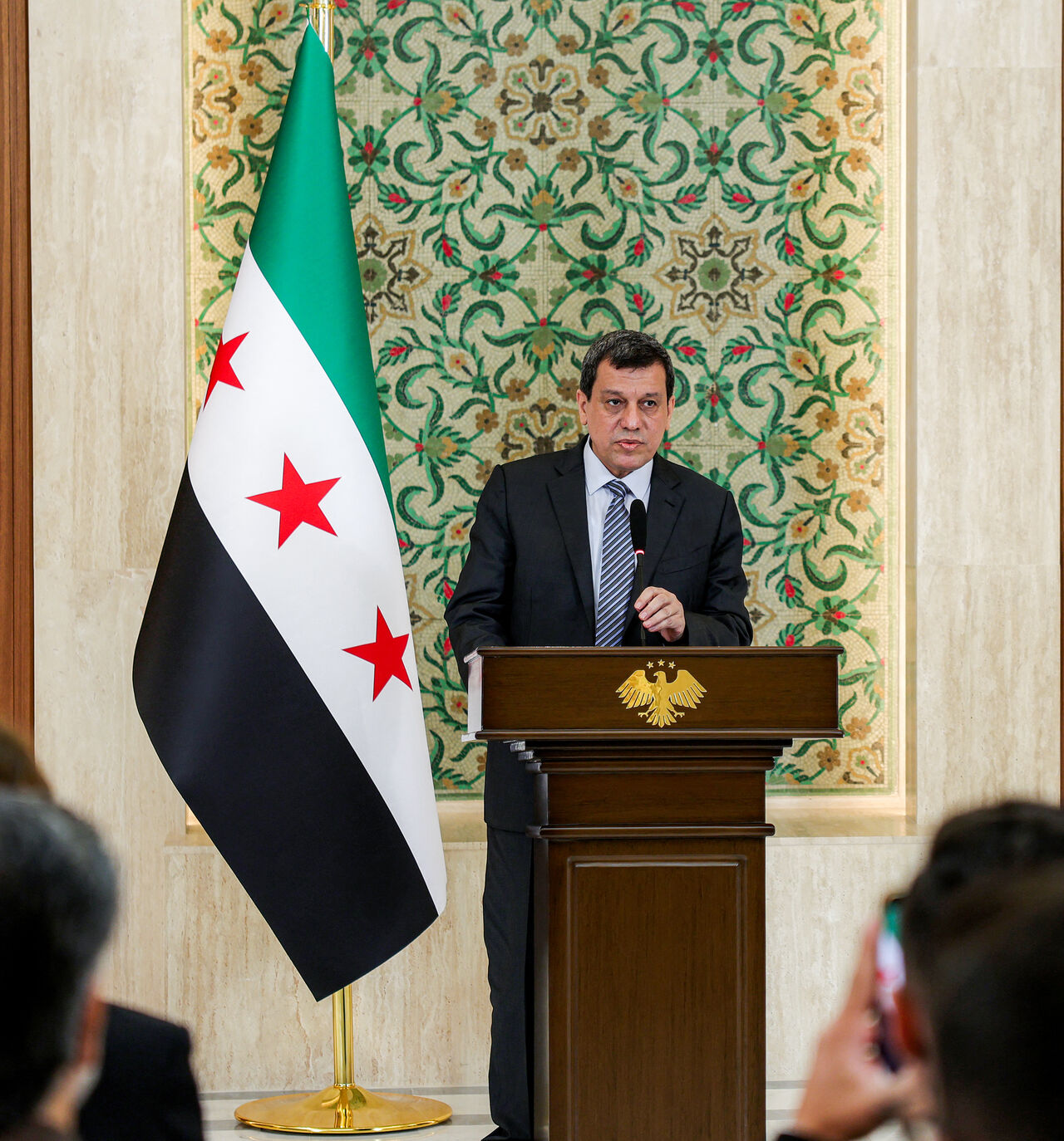 Mazloum Kobane, leader of the Kurdish-led Syrian Democratic Forces (SDF), speaks during a televised speech at the People's Palace in Damascus on Aug. 25, 2026.