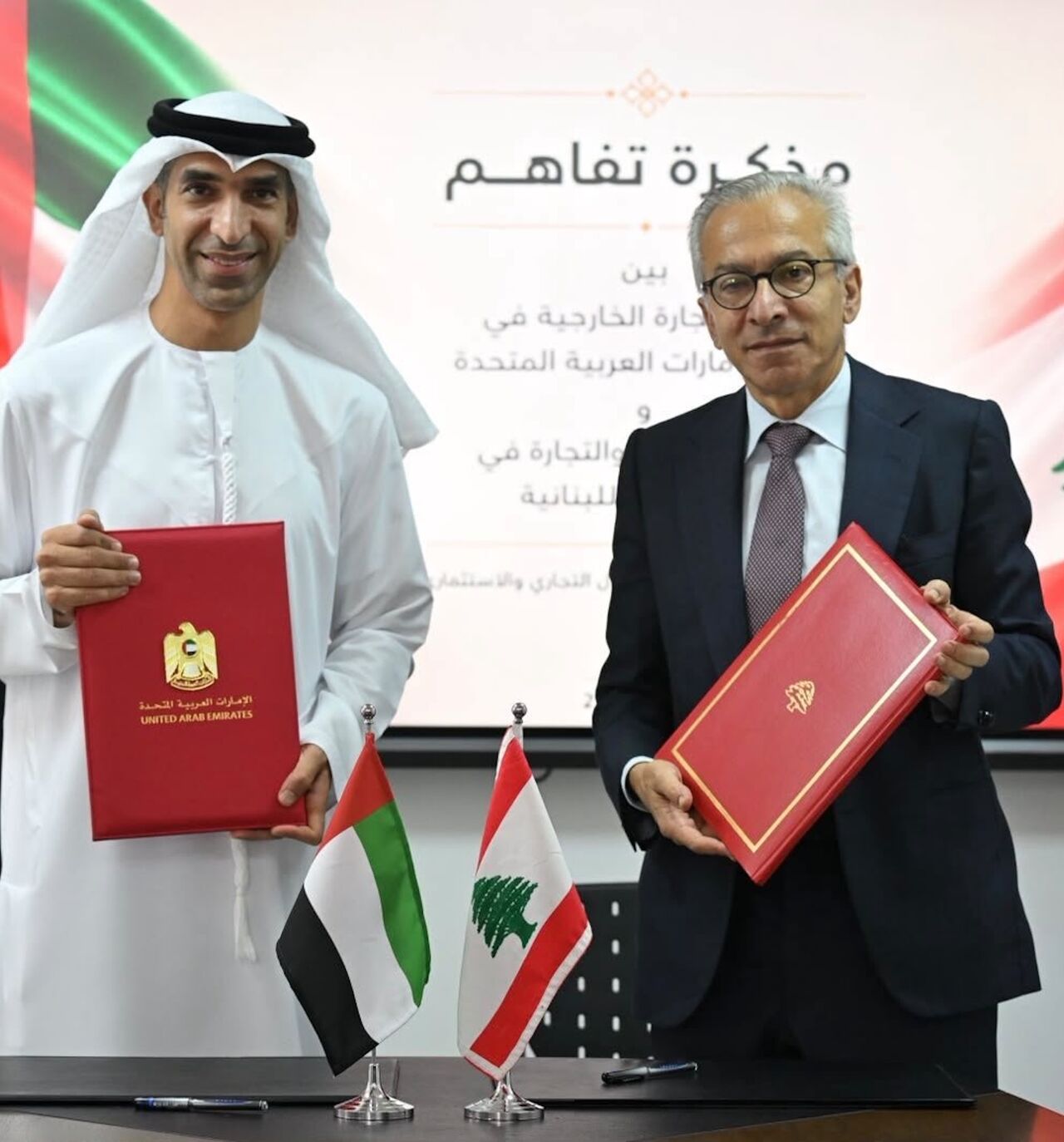 UAE Foreign Trade Minister Thani bin Ahmed Al Zeyoudi (L) and Lebanese Economy Minister Amr al-Bisat after signing a memorandum of understanding, Beirut, Aug. 27, 2026.