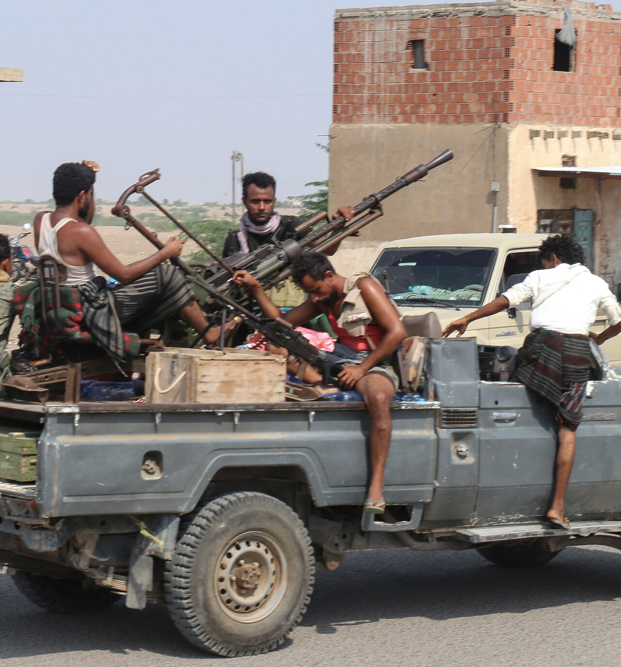 Forces loyal to Yemen's Saudi-backed government ride in a pick-up truck in the Hays district, south of Hodeidah, Yemen, Sept. 5, 2026.