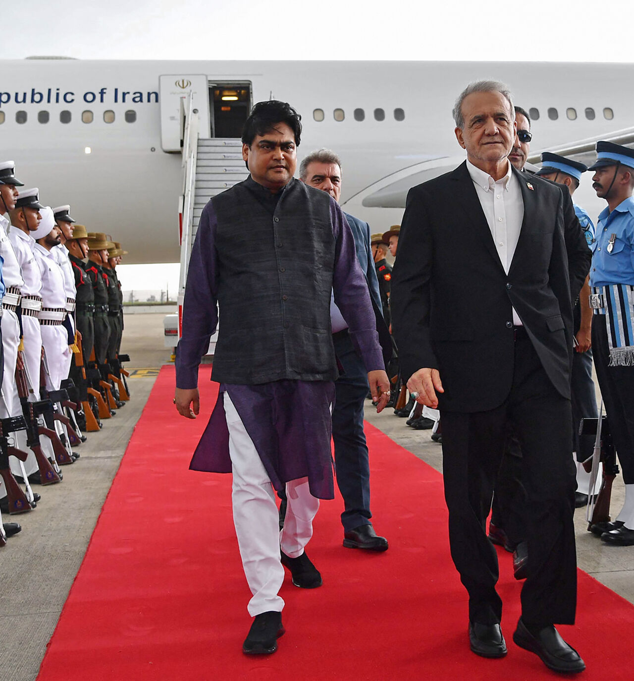 Iran's President Masoud Pezeshkian disembarks from his plane