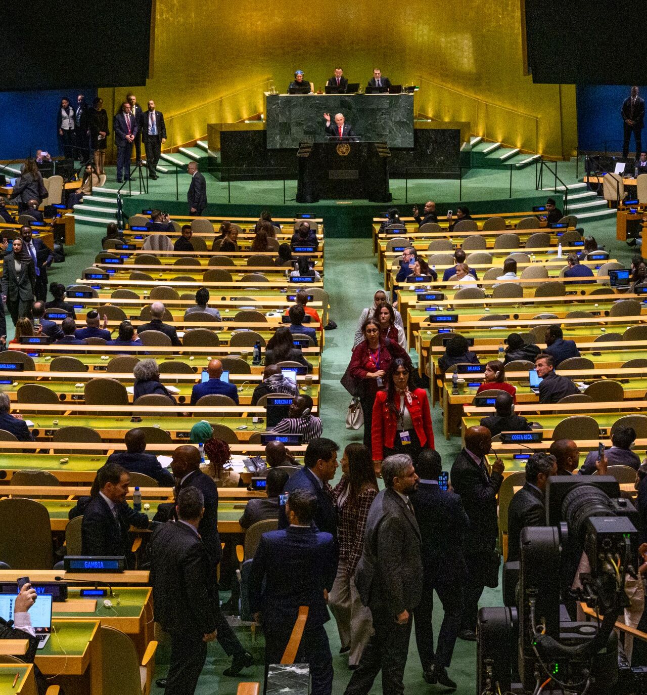 Prime Minister of Israel Benjamin Netanyahu waves to delegates leaving before his UN speech