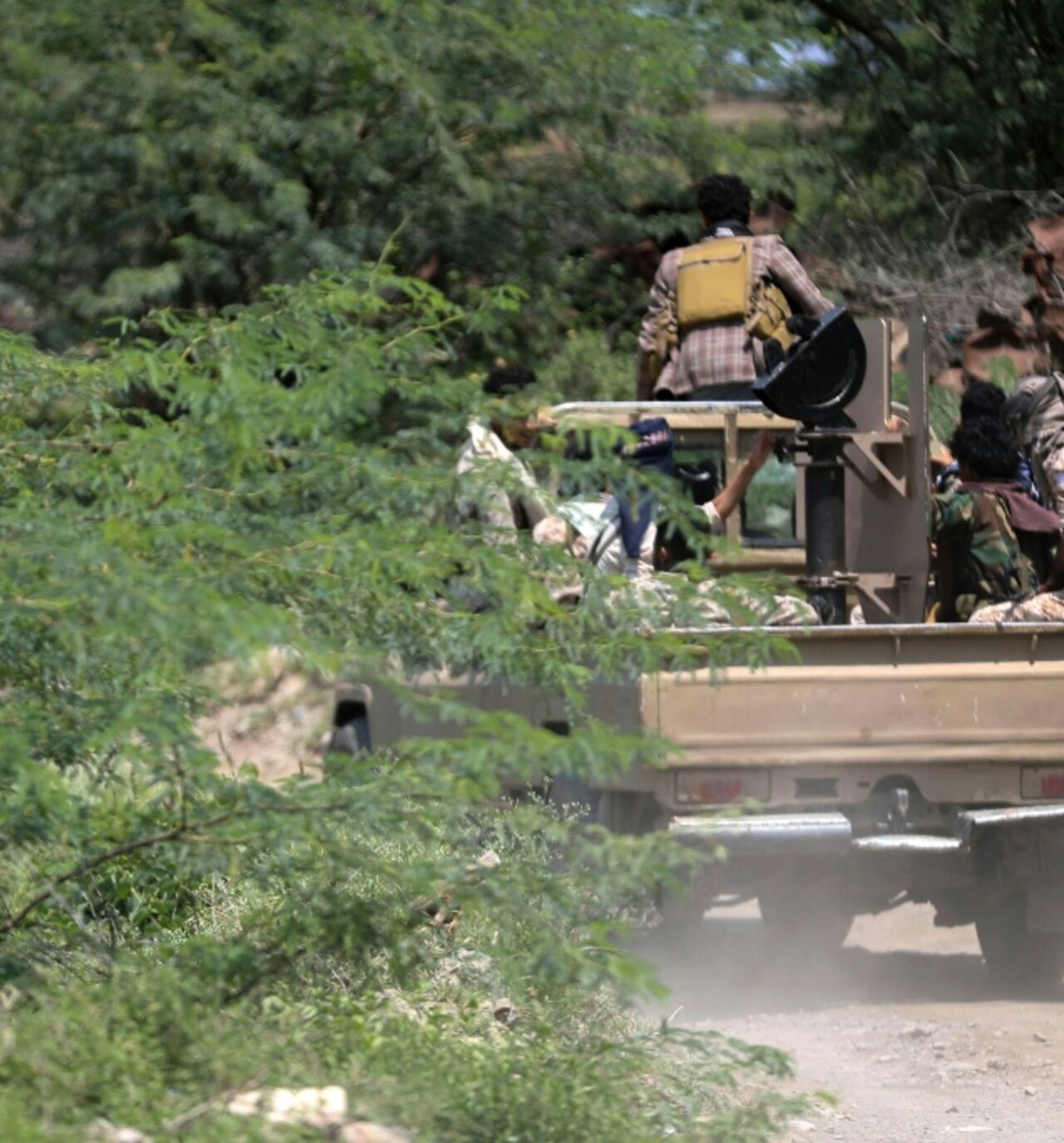 Saudi-backed Yemen government soldiers ride in a pick-up truck near the Jabal Han front, west of the city of Taiz, where battles are ongoing