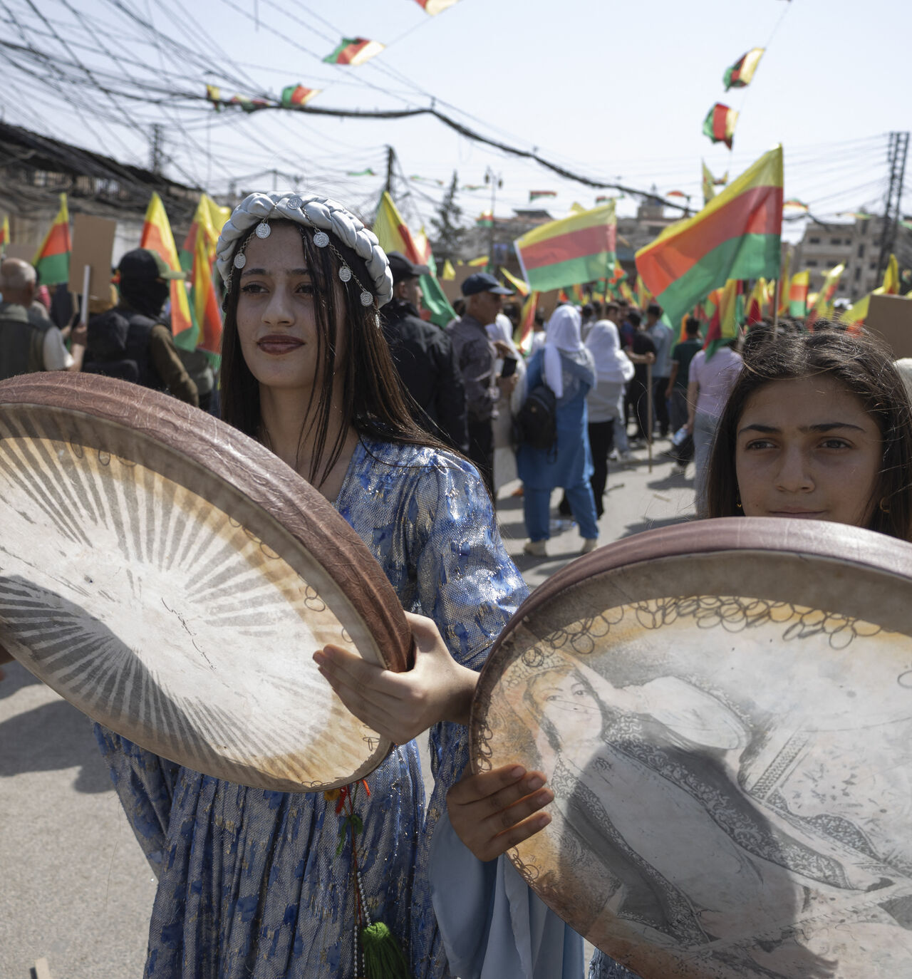 Youths play the daf, an Iranian frame drum, during a protest demanding the right to education in the Kurdish language in Al-Qamishli, Syria, on September 22, 2026. The demonstrations follow a decision by the Syrian Interim Government to allocate only Kurdish language classes in schools. (Photo by Amjad Kurdo / Middle East Images / AFP via Getty Images)
