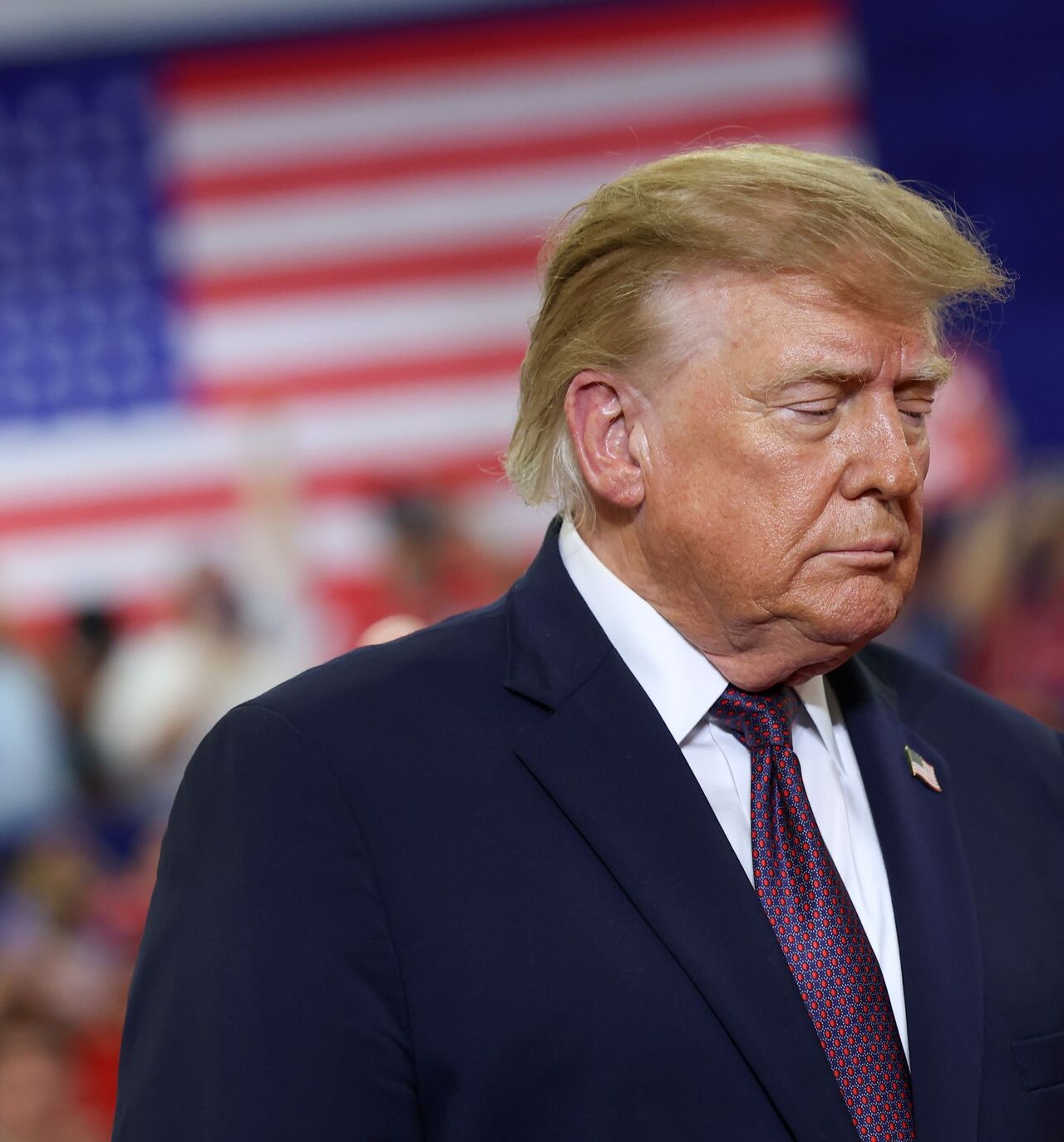 US President Donald Trump walks on stage