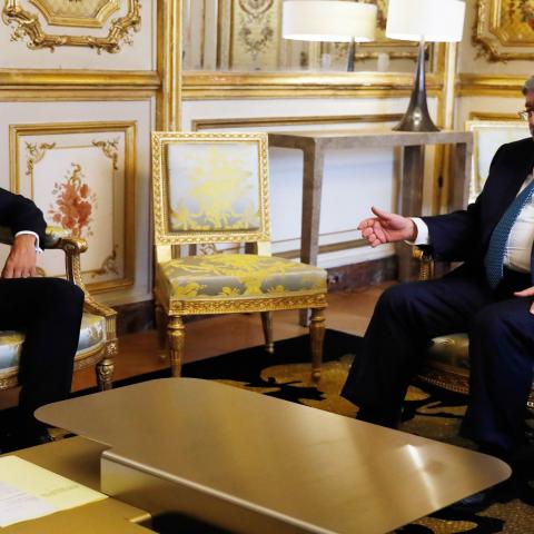 French President Emmanuel Macron meets Algerian Prime Minister Ahmed Ouyahia at the Elysee presidential palace before the opening of an international congress on Libya, Paris, France, May 29, 2018. 