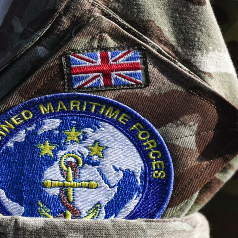 This picture taken on Nov. 5, 2019, during the International Maritime Exercise (IMX) in the Gulf waters off Bahrain shows a close-up of the badge of the Combined Maritime Forces (CMF) multinational naval partnership worn on the uniform of a British serviceman.