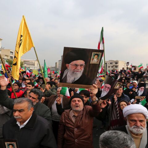 Iranians holding national flags and pictures of the Islamic republic's supreme leader, Ayatollah Ali Khamenei, take part in a pro-government demonstration in the capital, Tehran's, central Enghelab Square on Nov. 25, 2019, to condemn days of "rioting" that Iran blames on its foreign foes. In a shock announcement 10 days ago, Iran raised the price of petrol by up to 200%, triggering nationwide protests in a country whose economy has been battered by US sanctions.