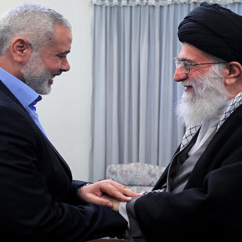 A handout photo made available by the office of Iran's supreme leader shows Iranian Supreme Leader Ayatollah Ali Khamenei greeting Ismail Haniya (L), Palestinian Hamas premier in the Gaza Strip, during a meeting in Tehran, Feb. 12, 2012.