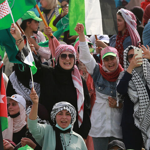 Supporters of Jordan's Muslim Brotherhood take part in a protest in the village of Sweimeh, near the Jordanian border with the occupied West Bank, on May 21, 2021, to express their solidarity with Palestinians and to celebrate the ceasefire. 