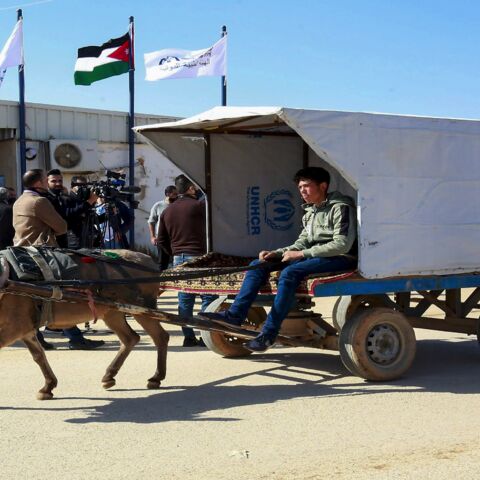 A Syrian refugee rides a donkey cart at the Zaatari refugee camp, 80 kilometers (50 miles) north of the Jordanian capital, Amman, on Feb. 15, 2021.