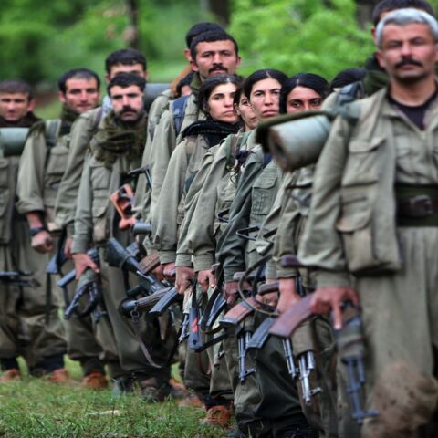 Kurdistan Workers Party (PKK) fighters arrive in the northern Iraqi city of Dahuk on May 14, 2013.