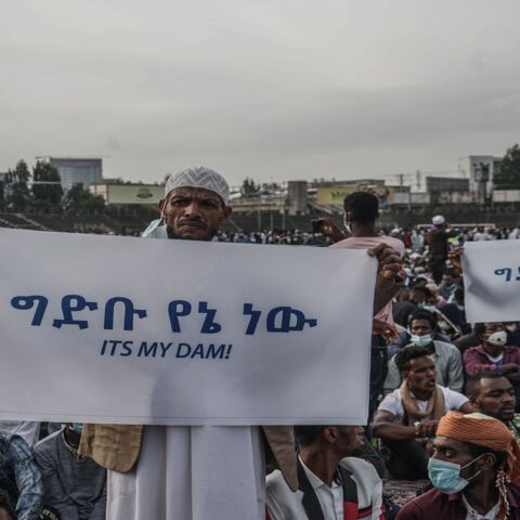 People hold placards to express their support for Ethiopia's megadam on the Blue Nile River.