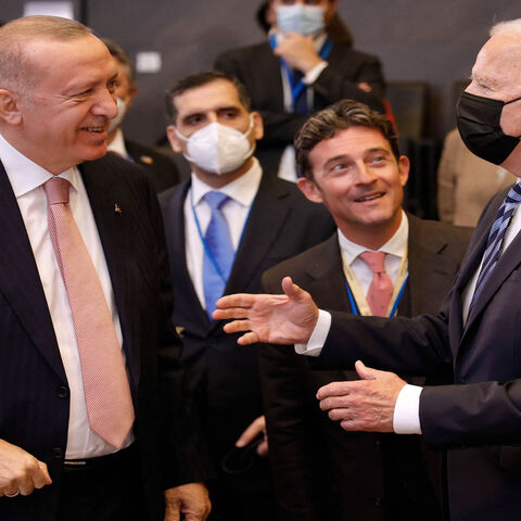 US President Joe Biden (R) speaks with Turkey's President Recep Tayyip Erdogan prior to a plenary session of a NATO summit at NATO headquarters, Brussels, Belgium, June 14, 2021.