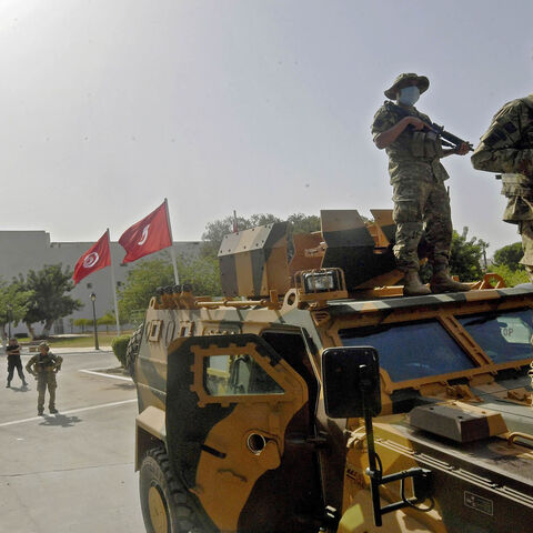 Tunisian military forces guard the area around the parliament building, following protests in reaction to a move by the president last night to suspend the parliament and dismiss the prime minister, Tunis, Tunisia, July 26, 2021.