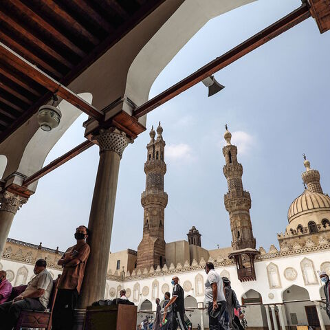 Muslim worshippers, mask-clad due to the COVID-19 coronavirus pandemic, arrive at the courtyard of the historic al-Azhar mosque in the centre of Islamic Cairo to perform the Friday prayers under new pandemic restrictions, in Egypt's capital on Aug. 28, 2020. 