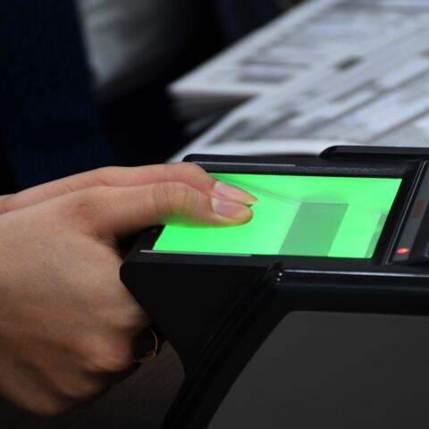 An Iraqi woman updates her voter registration at the Independent High Electoral Commission Center in the southern Iraqi city of Nasiriyah in the Dhi Qar province on Jan. 12, 2021.