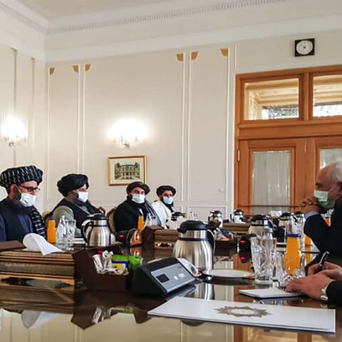 A picture obtained by AFP from the Iranian news agency Tasnim on January 31, 2021, shows Iran's Foreign Minister Mohammad Javad Zarif (2nd-R) meeting with Mullah Abdul Ghani Baradar (2nd-L) of the Taliban in Tehran. 