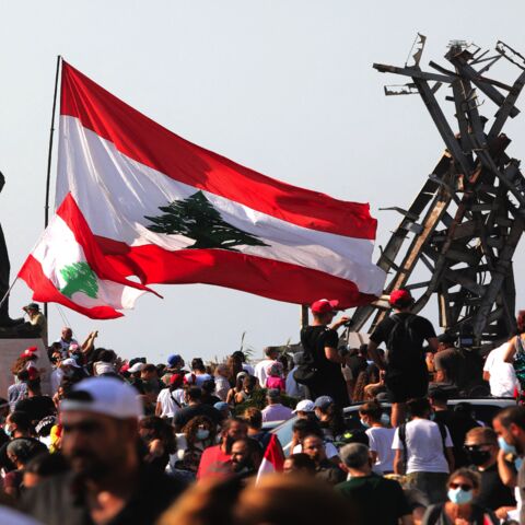 Demonstrators gather outside the port of Lebanon's capital, Beirut, on the first anniversary of the blast that ravaged the port and the city on Aug. 4, 2021.