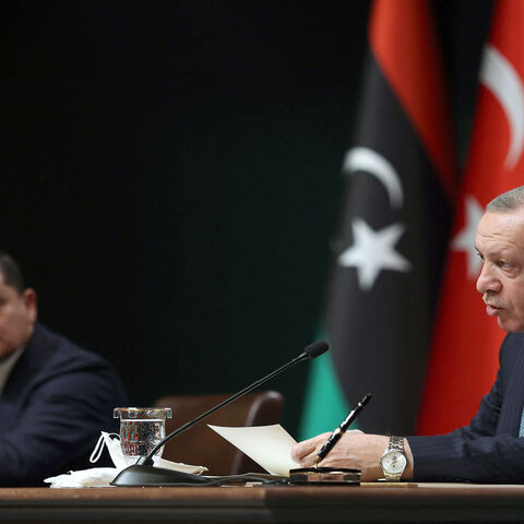Turkish President Recep Tayyip Erdogan (R) and Libyan Government of National Unity Prime Minister Abdulhamid Dbeibeh attend a signing ceremony after their meeting at the presidential palace, Ankara, Turkey, April 12, 2021.
