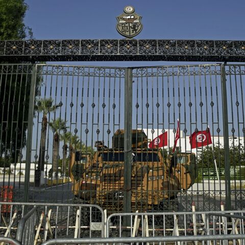 The Tunisian army barricades the parliament building in the capital, Tunis, on July 26, 2021, after the president dismissed the prime minister and ordered parliament closed for 30 days.