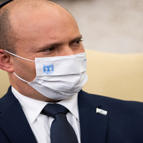 Israeli Prime Minister Naftali Bennett listens during a meeting with US President Joe Biden in the Oval Office at the White House, Washington, Aug. 27, 2021.