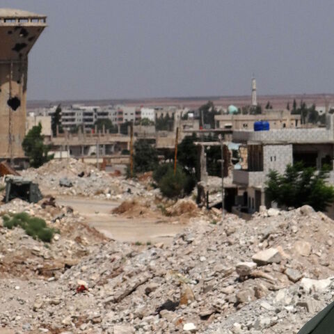 A picture shows a Russian flag on a Russian military vehicle in the Syrian district of Daraa al-Balad in Syria's southern province of Daraa, on Sept. 1, 2021. 