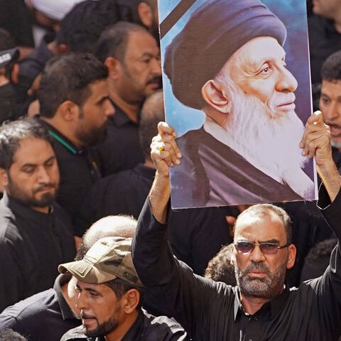 Iraqis attend the funeral of Ayatollah Mohammad Said al-Hakim, one of Iraq's top four Shiite clerics, at the Imam Ali shrine in Iraq's central holy shrine city of Najaf on Sept. 5, 2021. 