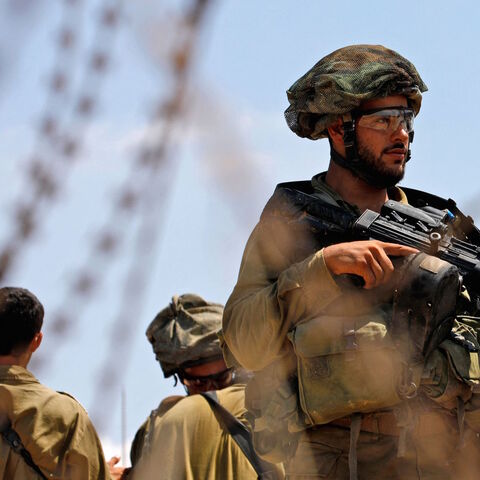 Israeli security forces patrol along the security fence in the village of Muqeibila near the West Bank town of Jenin on Sept. 6, 2021, following the escape of six Palestinians from an Israeli prison. 